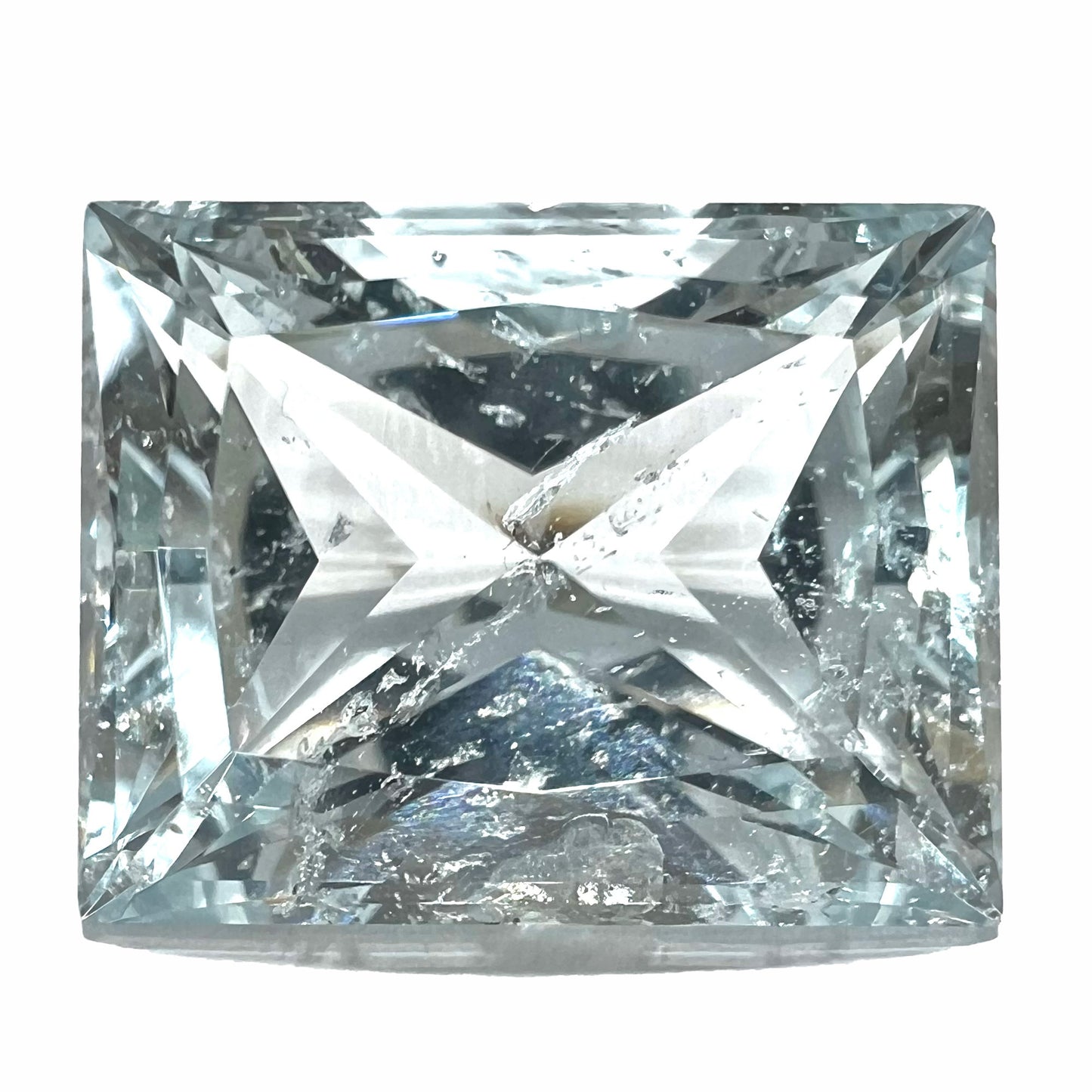 A loose, faceted French cut Russian topaz gemstone.  The stone is a light blue color.