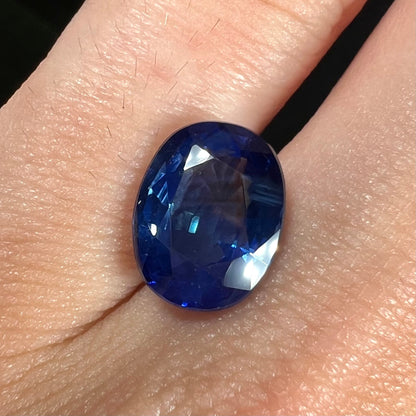 A natural, faceted oval cut blue sapphire stone that weighs 4.80 carats.