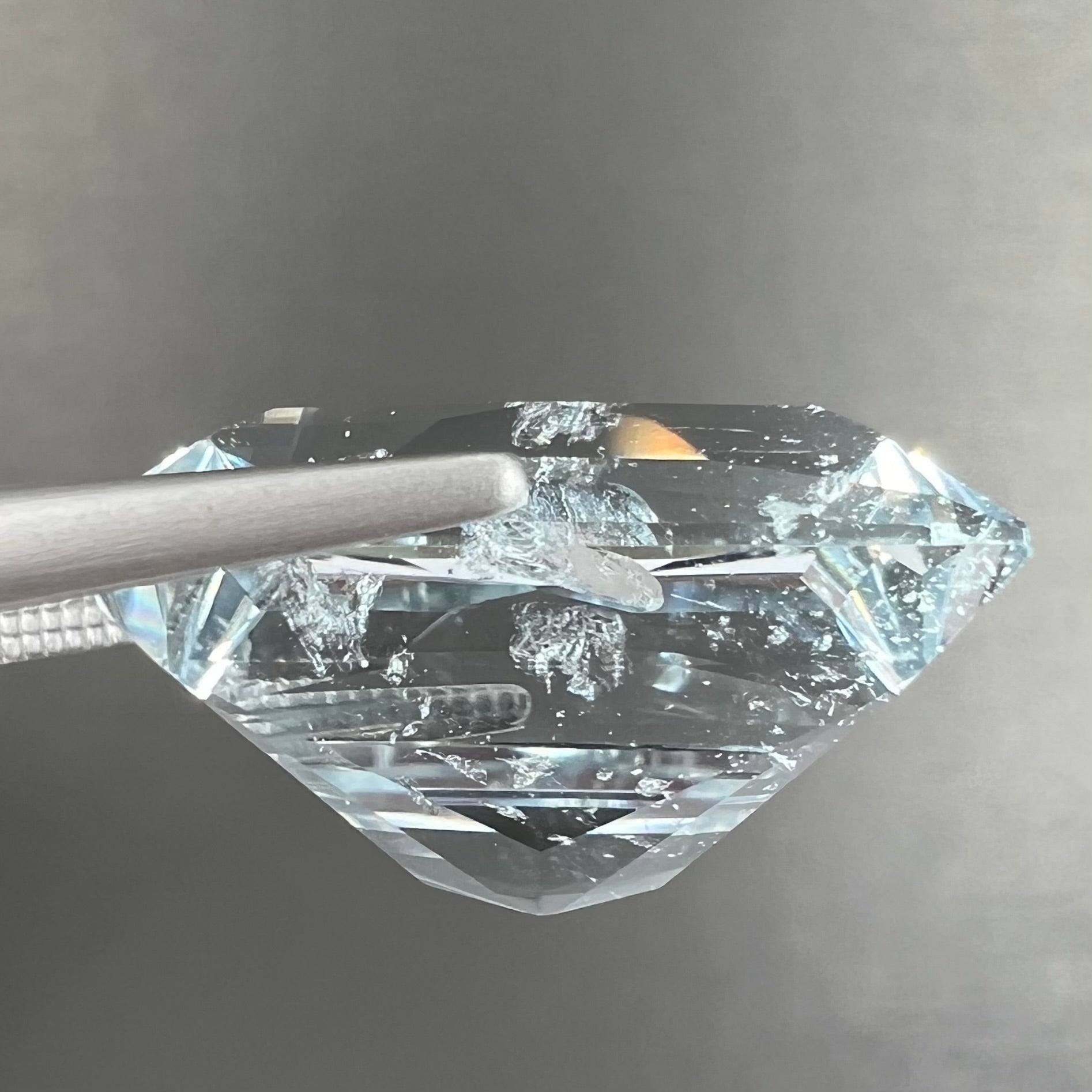 A loose, faceted French cut Russian topaz gemstone.  The stone is a light blue color.