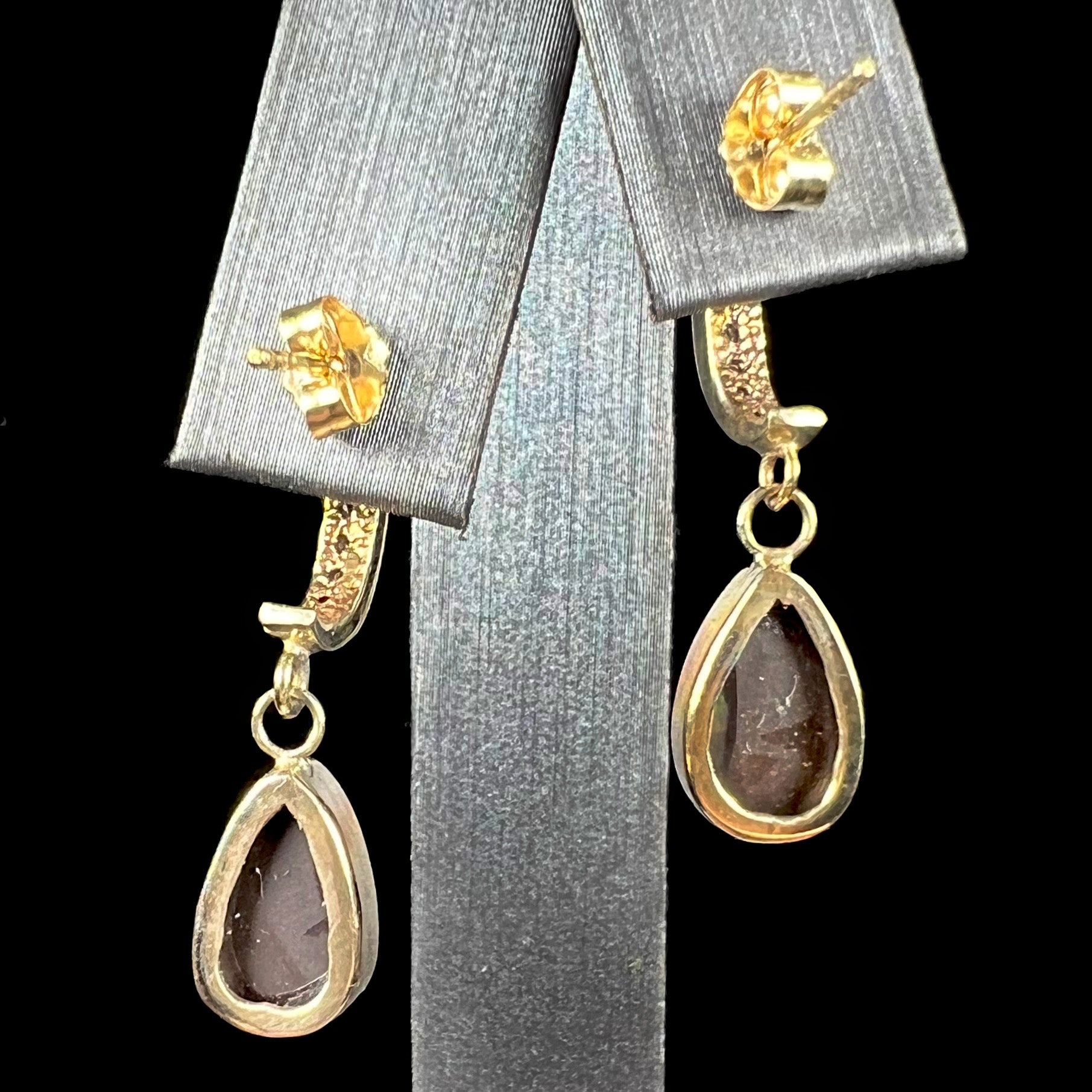 A pair of yellow gold dangle earrings set with natural pear shaped boulder opals and diamonds.