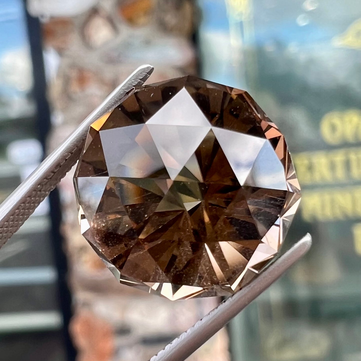 A loose, modified brilliant Portuguese cut smoky quartz gemstone.