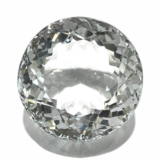 A large, round brilliant cut white topaz gemstone.