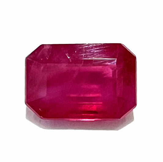 A natural, emerald cut Burma ruby gemstone.  The stone is pinkish red color.