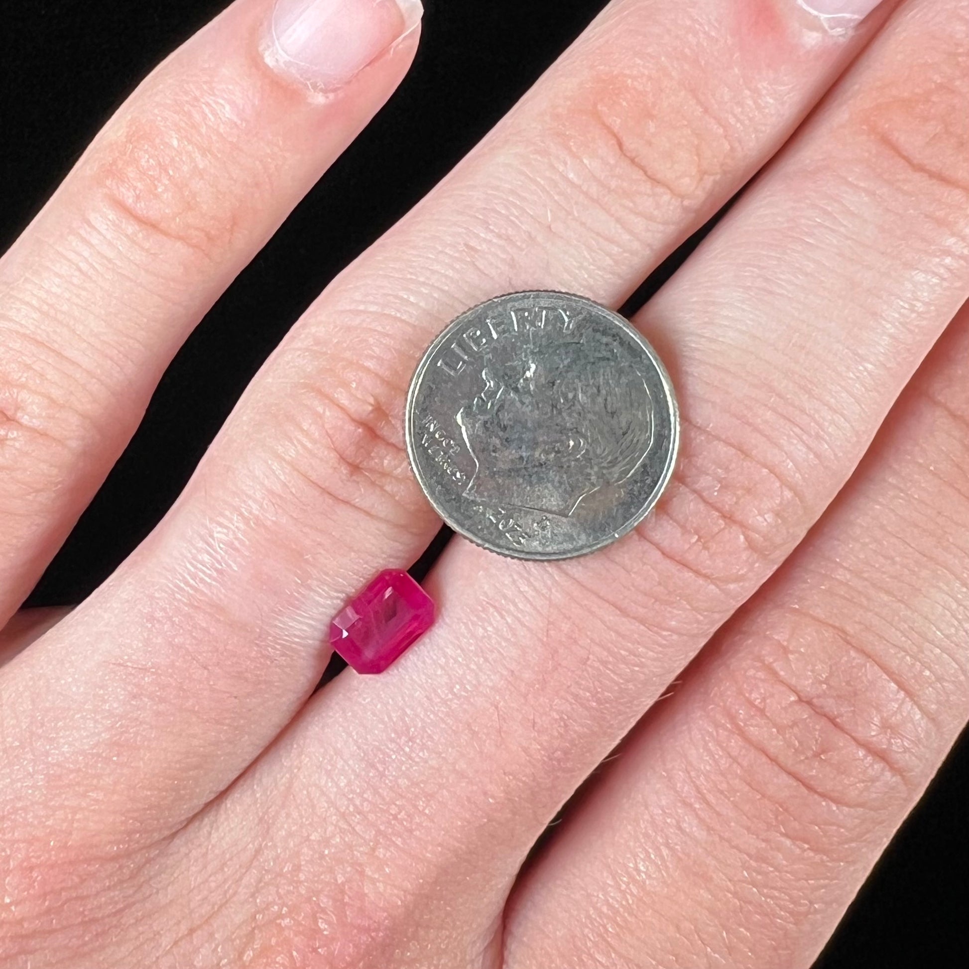 A natural, emerald cut Burma ruby gemstone.  The stone is pinkish red color.