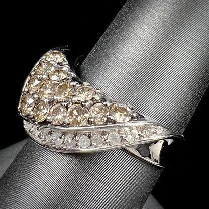 A ladies' white gold ring set with clusters of brown champagne and white diamonds.