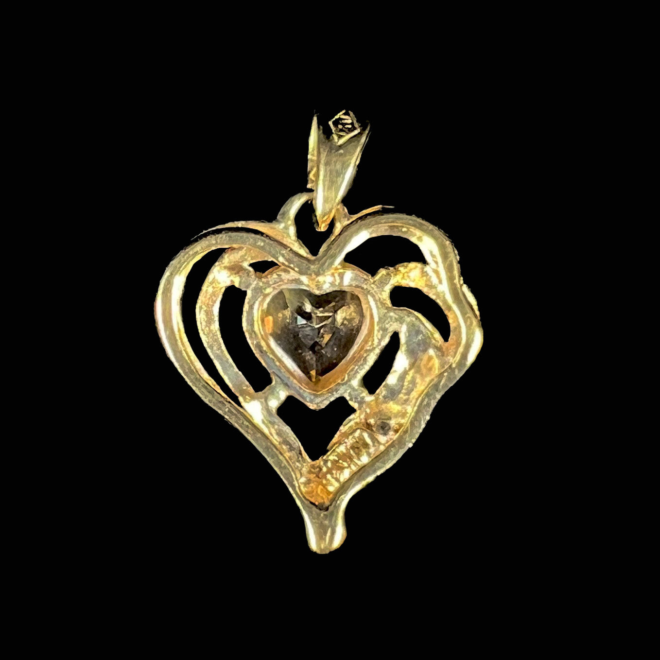 A ladies' yellow gold pendant set with a heart cut citrine stone and a diamond accent.