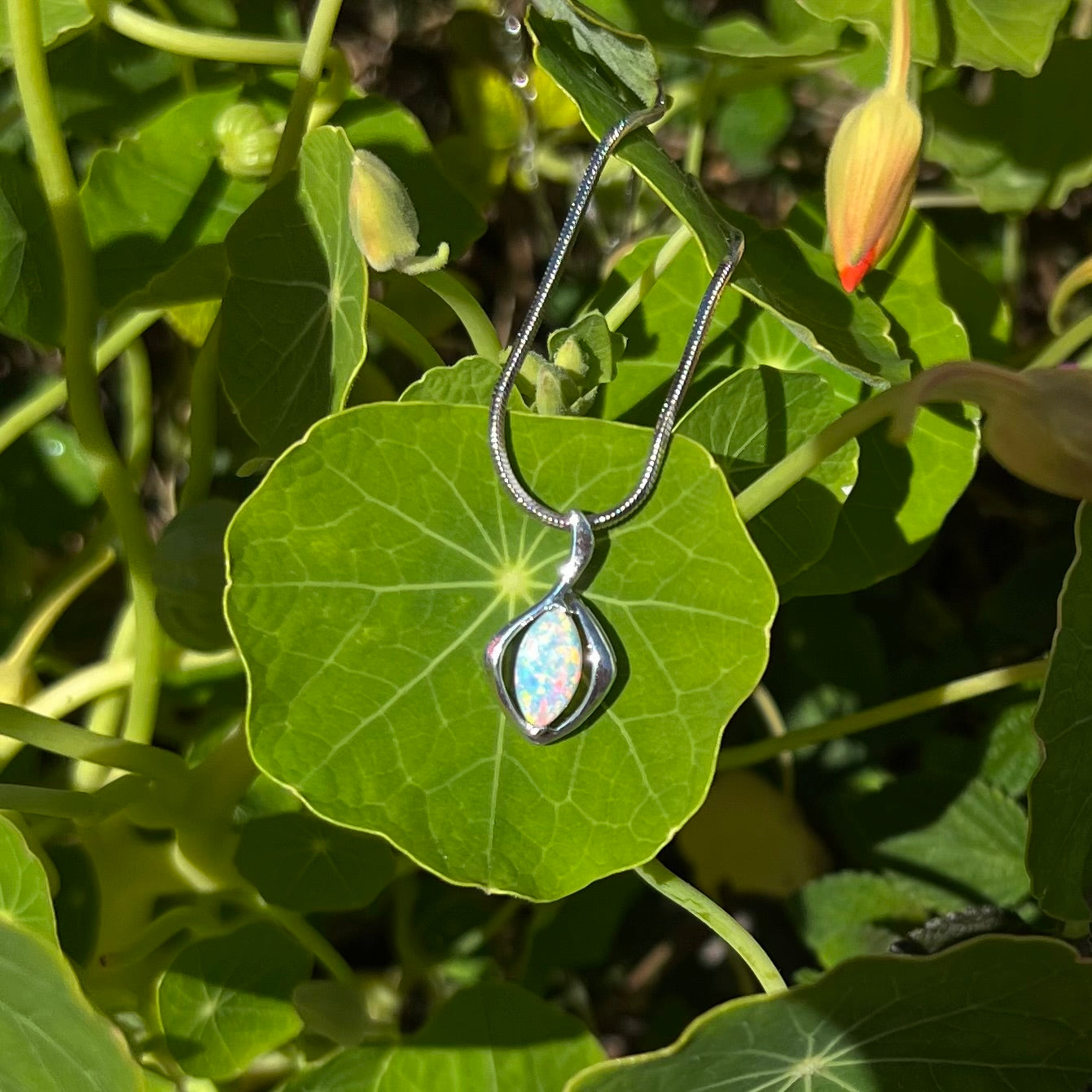 A natural, marquise cut white crystal opal necklace in sterling silver.