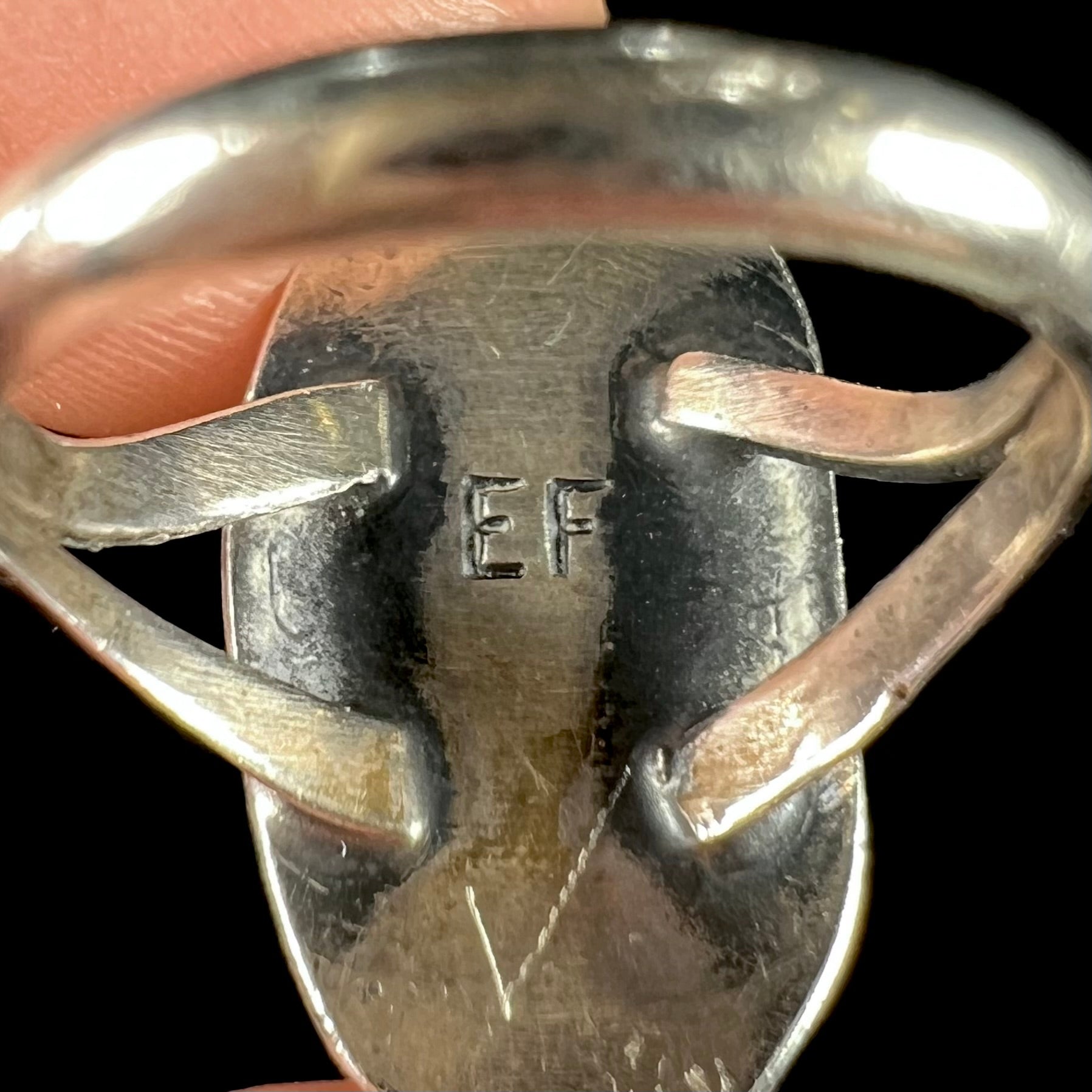 A handmade sterling silver Navajo style ring set with a Morenci turquoise stone.