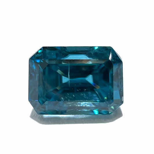 A natural blue zircon gemstone.  The stone is emerald cut.