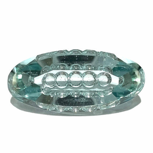 An oval fantasy cut greenish blue aquamarine stone cut by gem carver, Arthur Lee Anderson.