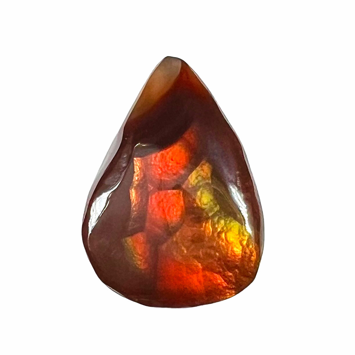 A loose, pear shaped Mexican fire agate gemstone.  The stone is predominantly vivid red with green overtones.