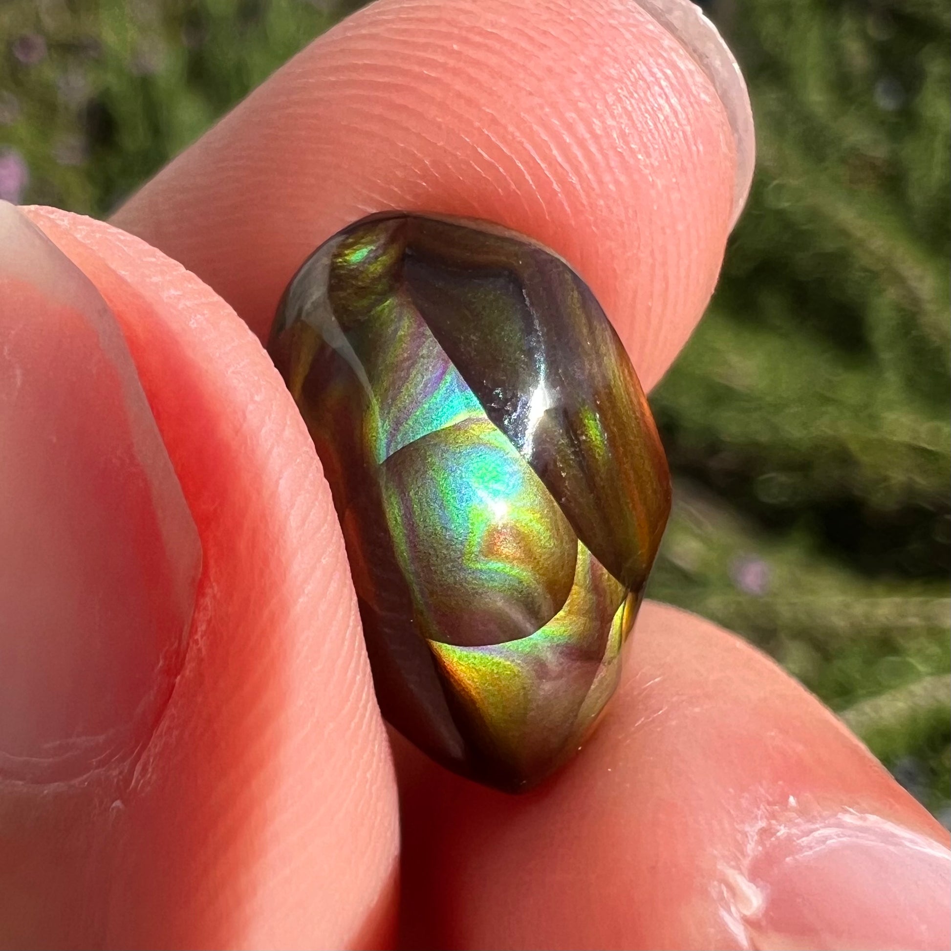 A loose, gem grade Mexican fire agate stone.  The stone is finely banded and ice blue green color.