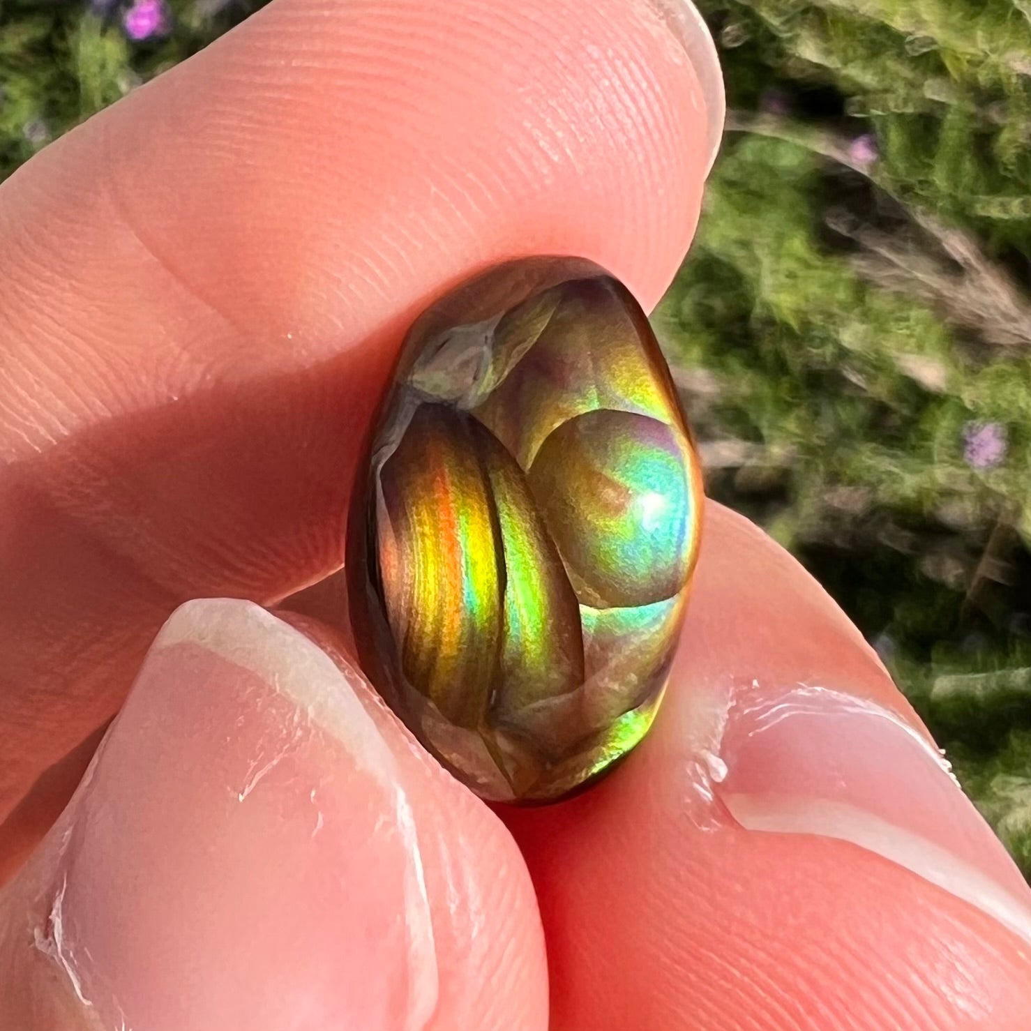 A loose, gem grade Mexican fire agate stone.  The stone is finely banded and ice blue green color.