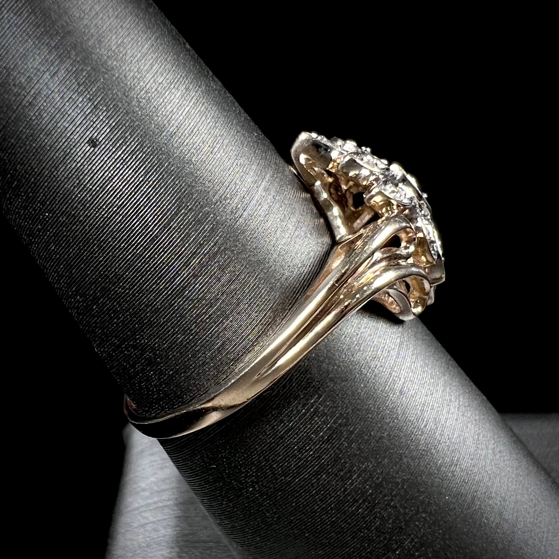 A ladies' vintage style gold diamond cluster ring.