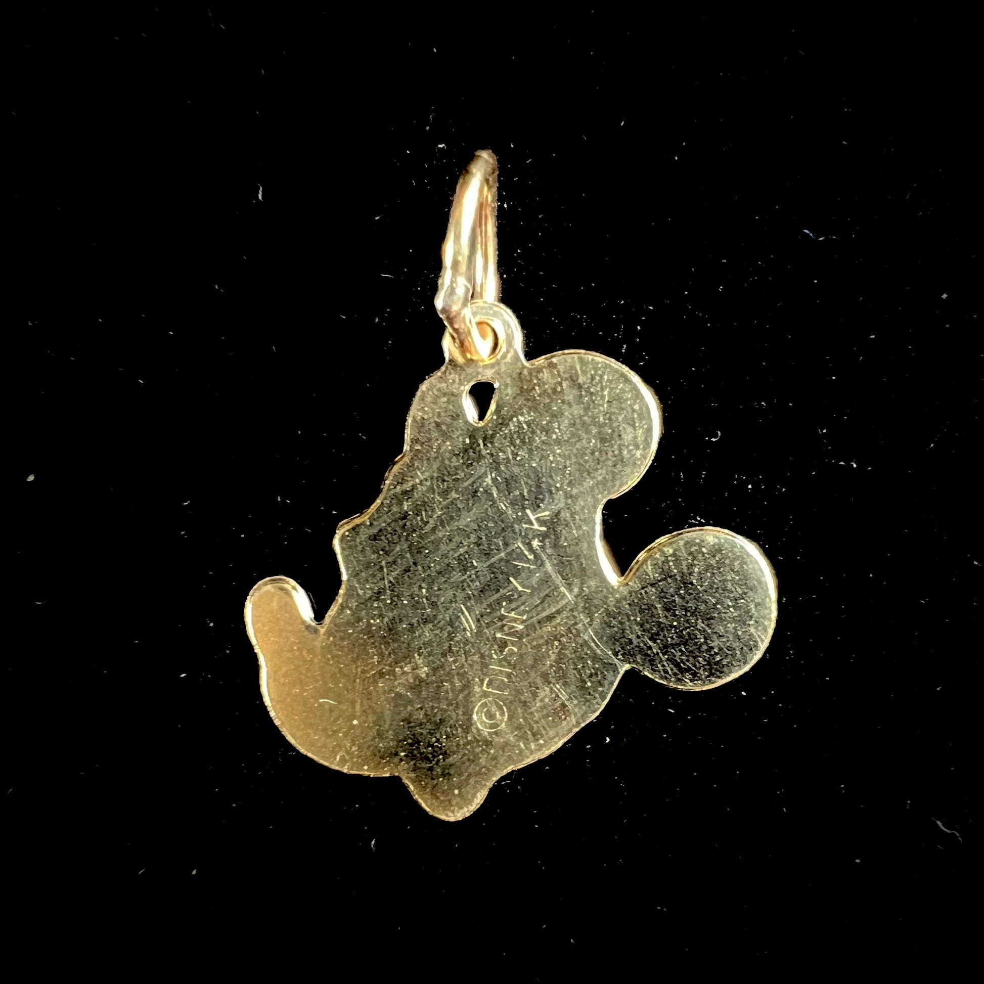 A dainty yellow gold Minnie Mouse pendant.