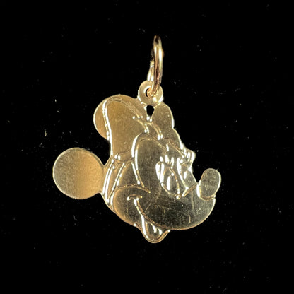 A dainty yellow gold Minnie Mouse pendant.