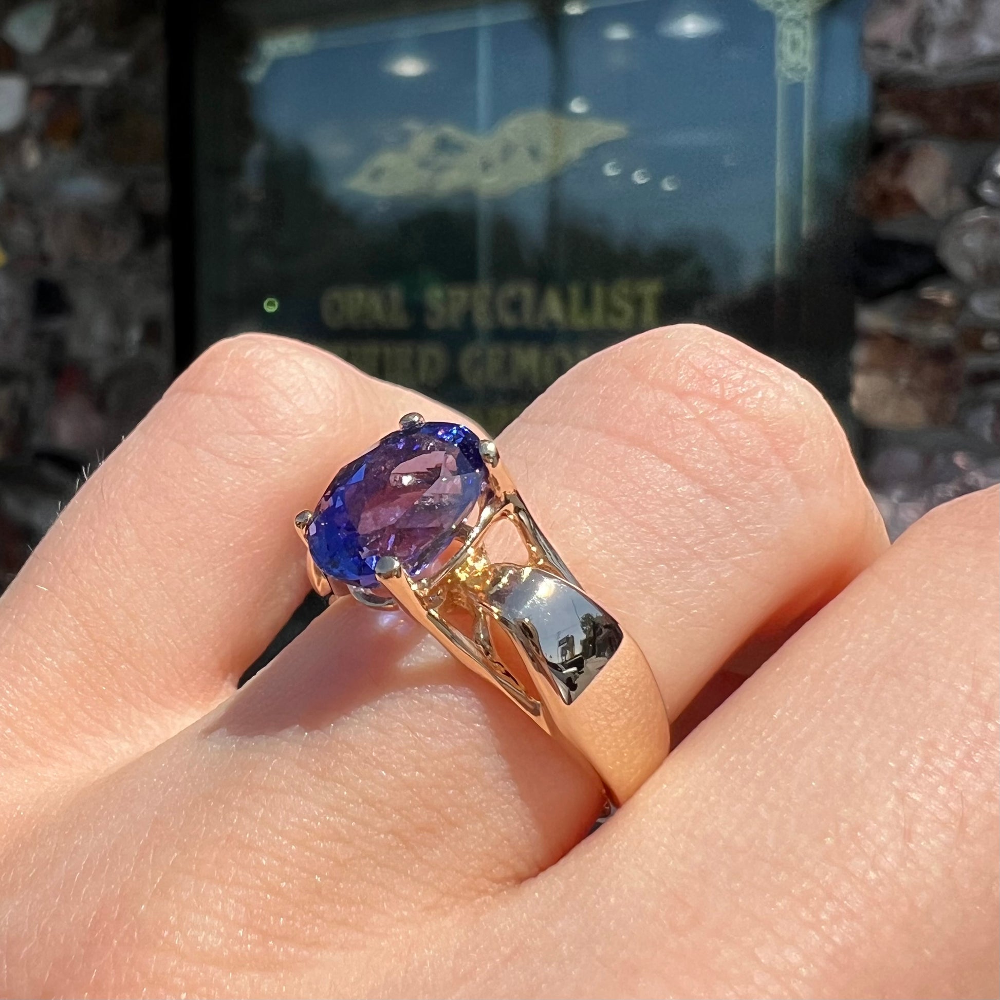A ladies' oval cut tanzanite solitaire ring set in yellow gold.