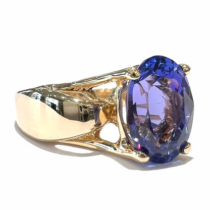 A ladies' oval cut tanzanite solitaire ring set in yellow gold.
