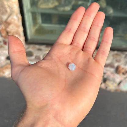 A loose, faceted octagon gray base crystal opal from Lightning Ridge, Australia.