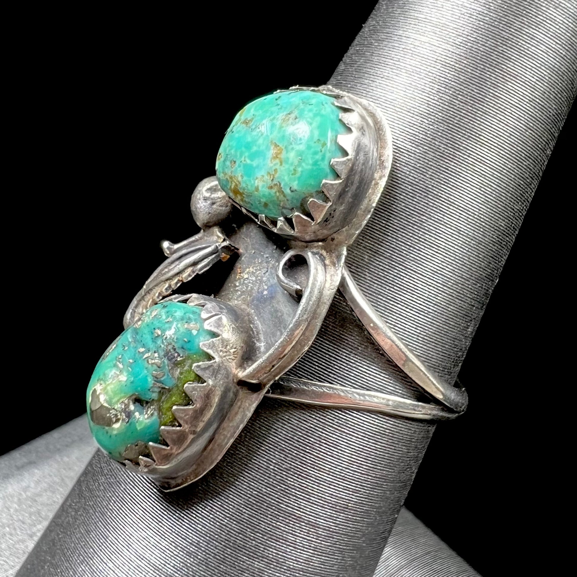 A ladies' sterling silver and green Morenci turquoise ring.  The ring is handmade in the Navajo style.