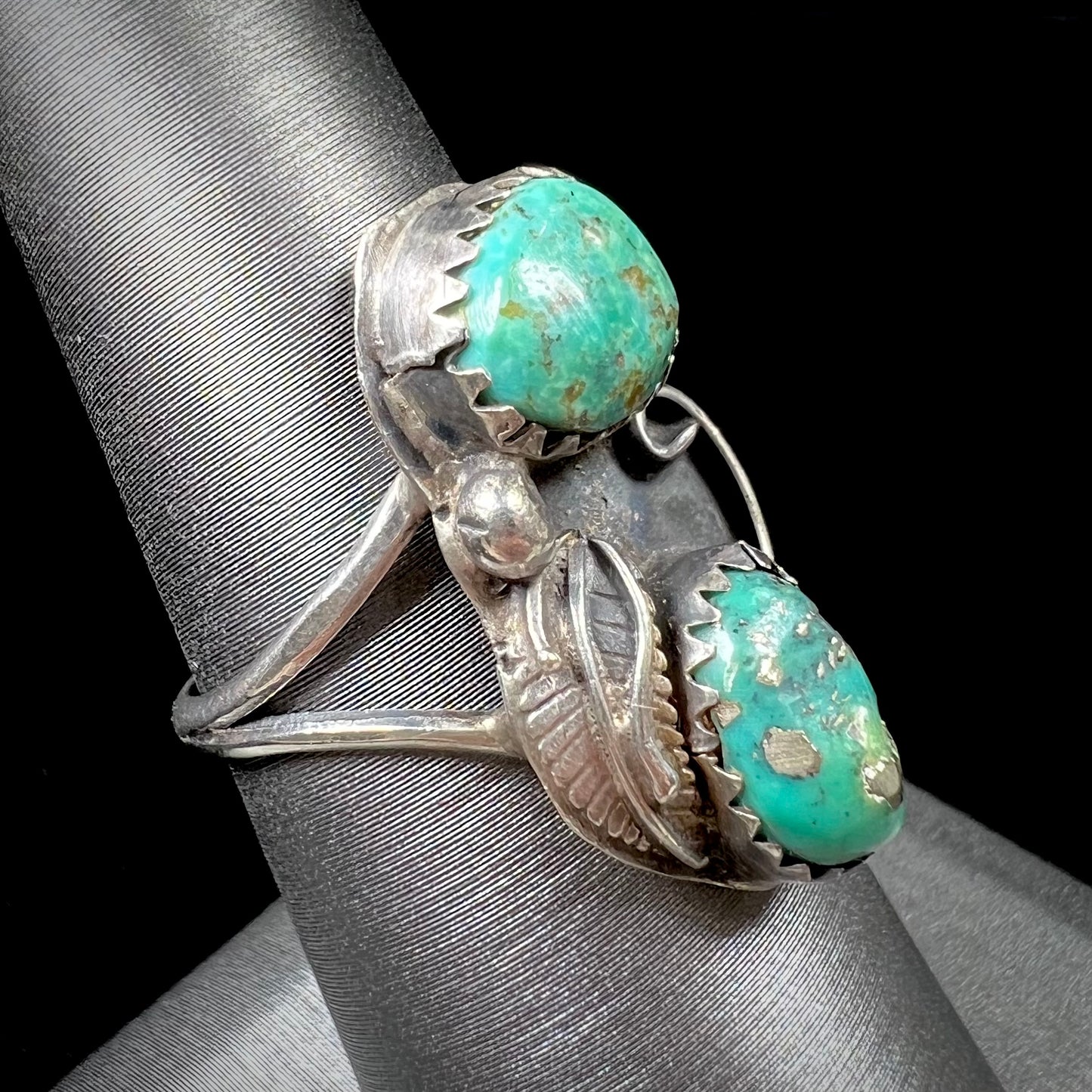 A ladies' sterling silver and green Morenci turquoise ring.  The ring is handmade in the Navajo style.