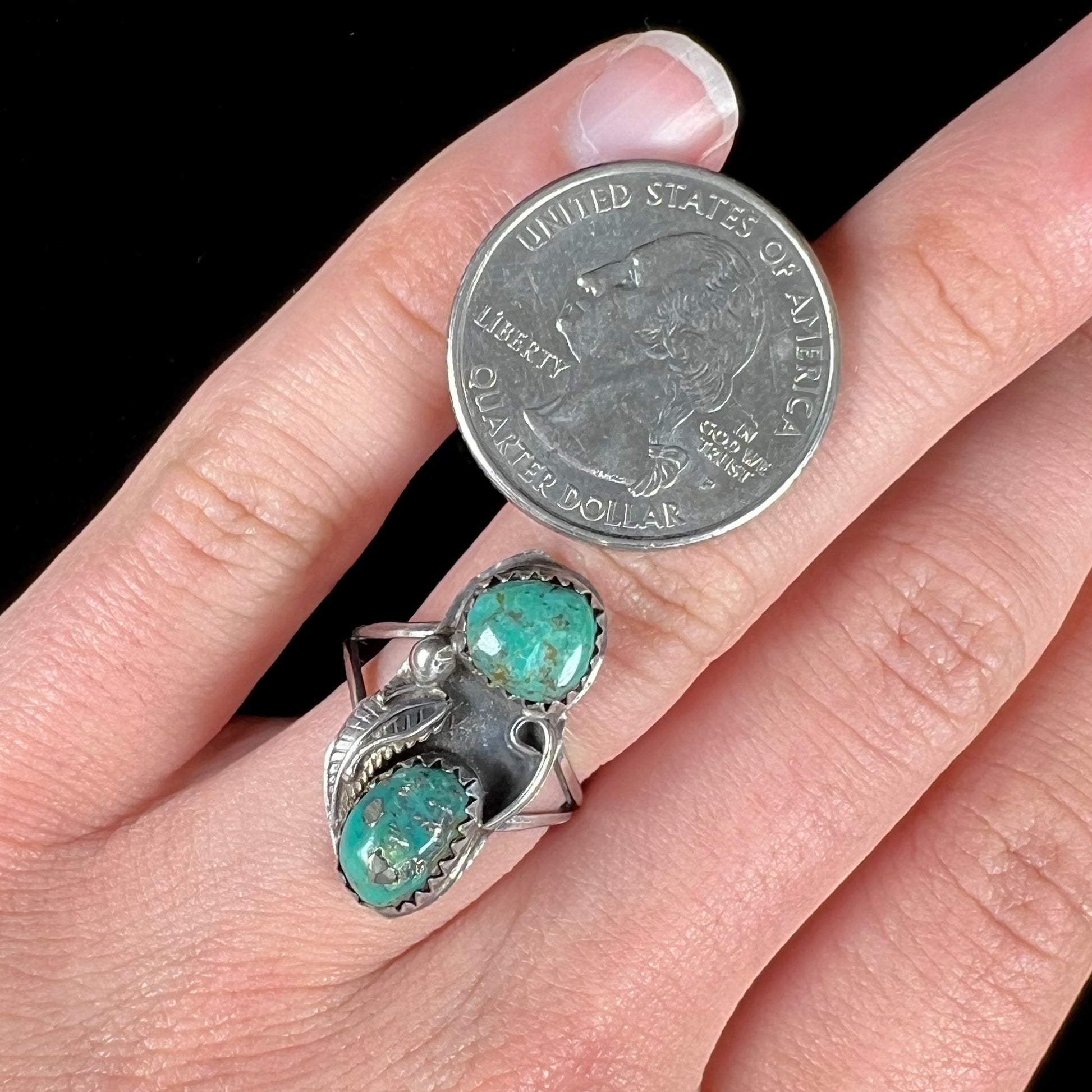 A ladies' sterling silver and green Morenci turquoise ring.  The ring is handmade in the Navajo style.