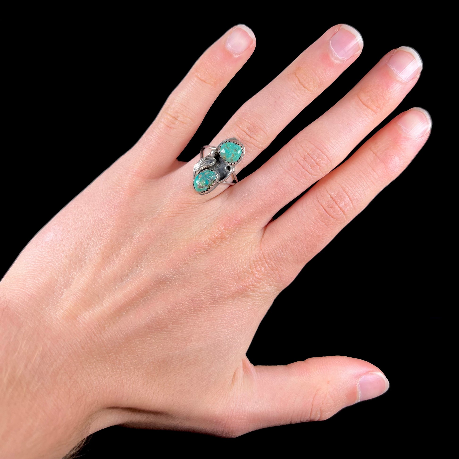 A ladies' sterling silver and green Morenci turquoise ring.  The ring is handmade in the Navajo style.