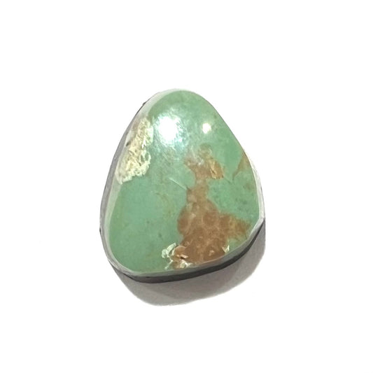 A loose, green Royston turquoise stone.  The stone has a brown matrix.
