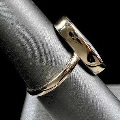 Ladies' yellow gold solitaire ring bezel set with a natural green striped boulder opal from Quilpie, Australia.