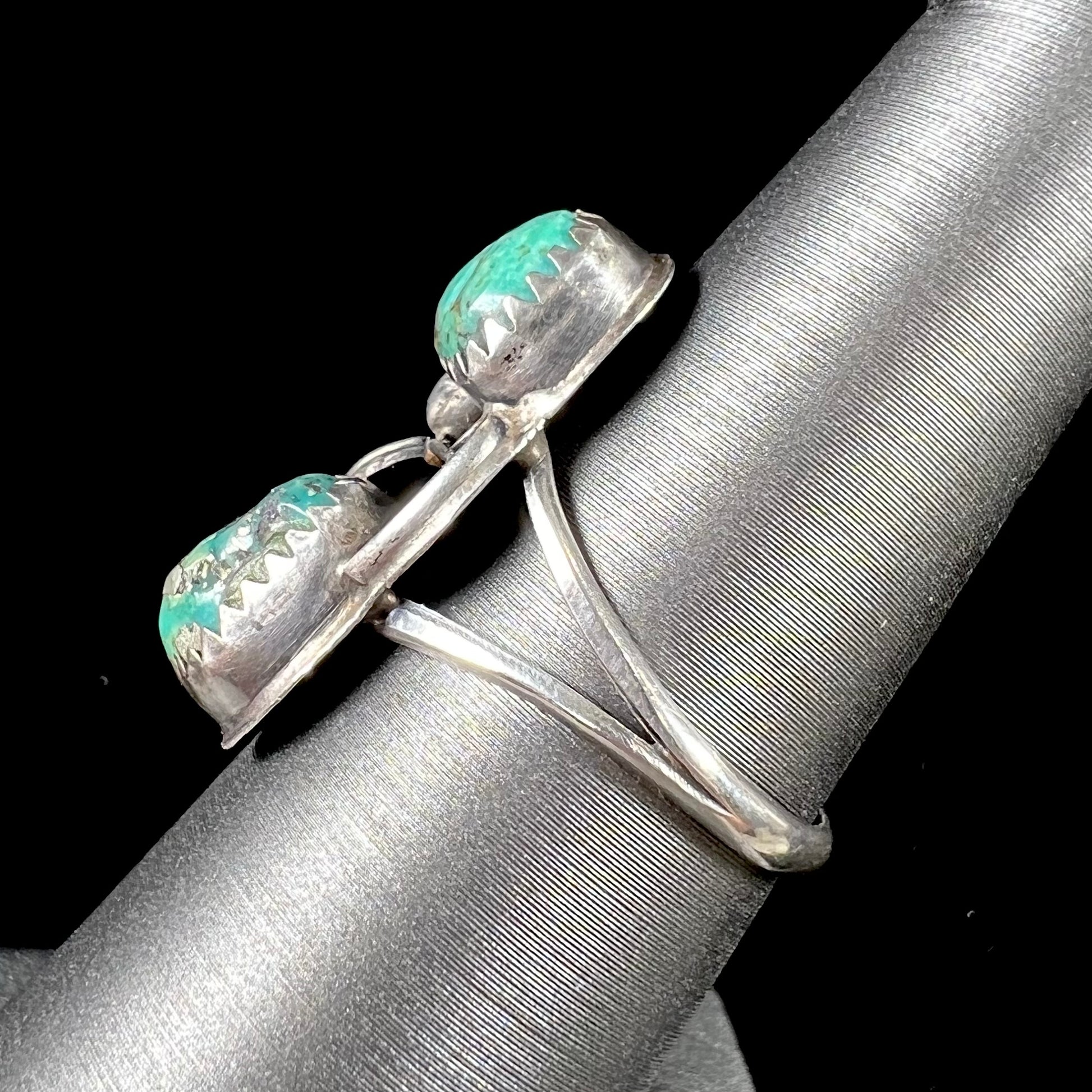 A ladies' sterling silver and green Morenci turquoise ring.  The ring is handmade in the Navajo style.