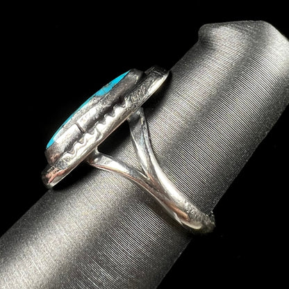 A handmade sterling silver Navajo style ring set with a Morenci turquoise stone.
