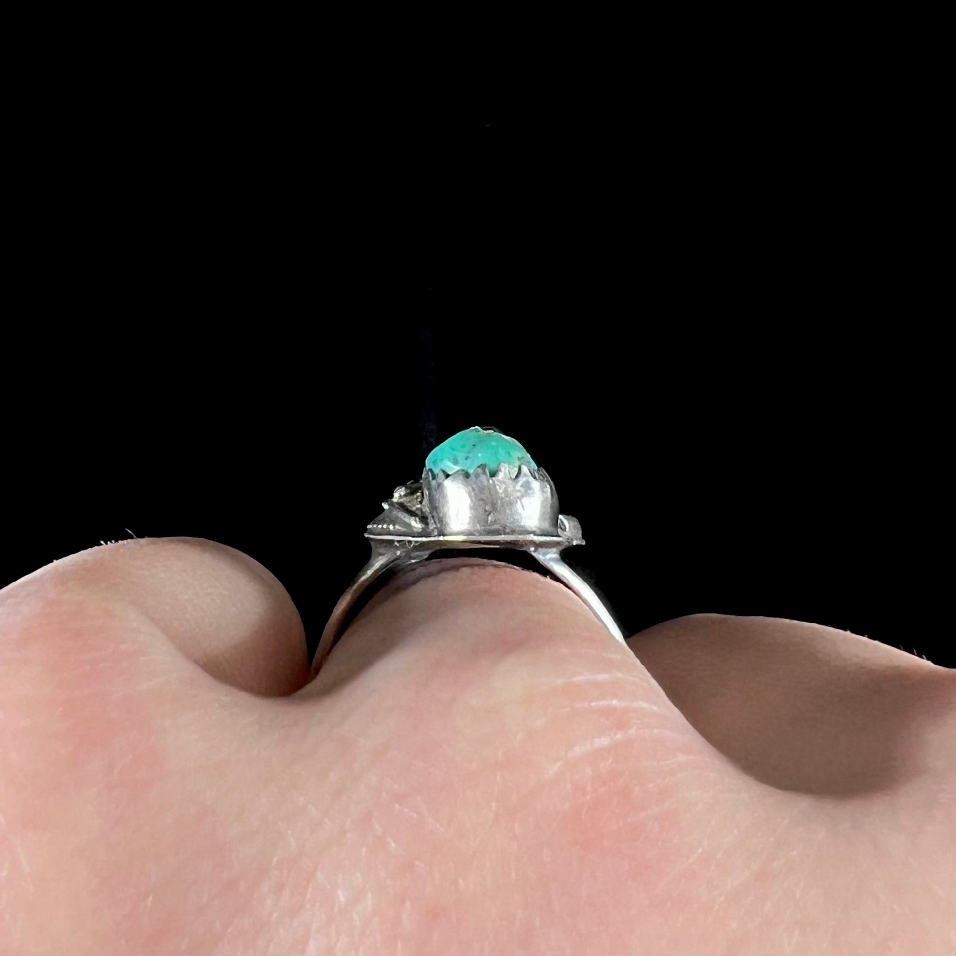 A ladies' sterling silver and green Morenci turquoise ring.  The ring is handmade in the Navajo style.