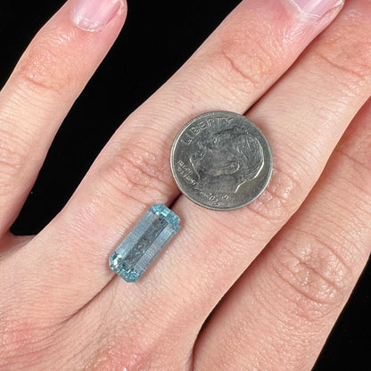 A loose, emerald cut aquamarine stone from Vietnam.  The stone is an ice blue color.