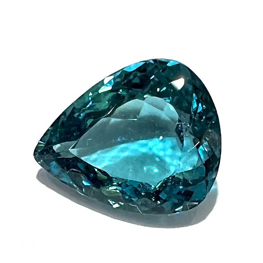 A loose, pear shaped green-blue indicolite tourmaline stone.