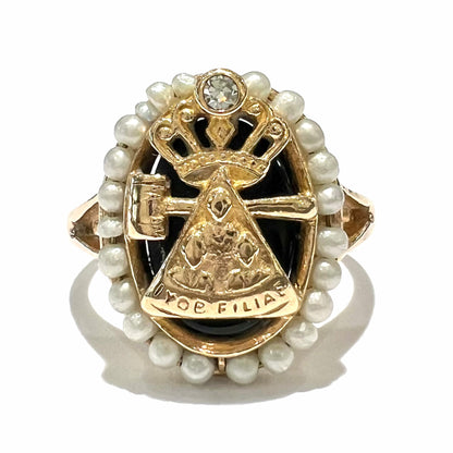 A ladies' Job's Daughters youth organization ring cast in 14 karat gold, set with a diamond and string of pearls.