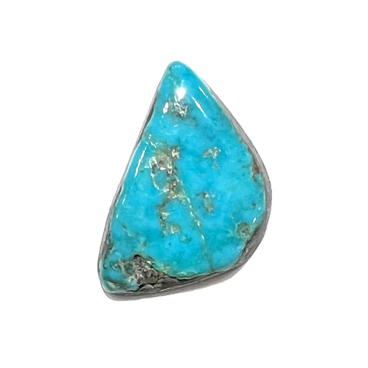 A loose, freeform turquoise cabochon stone from Kingman, Arizona.