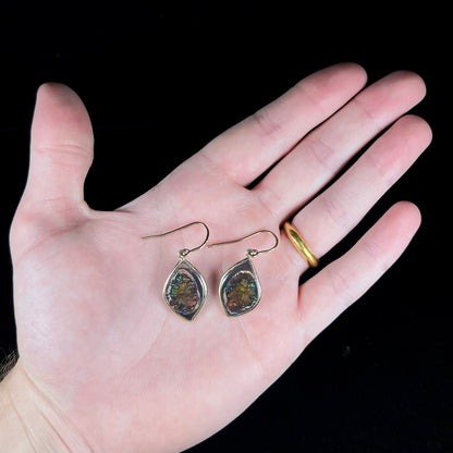 A pair of yellow gold dangle earrings bezel set with natural boulder opals from Koroit, Australia.