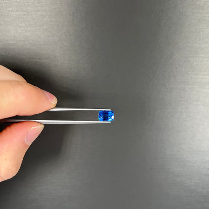 A loose, blue kyanite gemstone.  The stone is a faceted cushion cut.