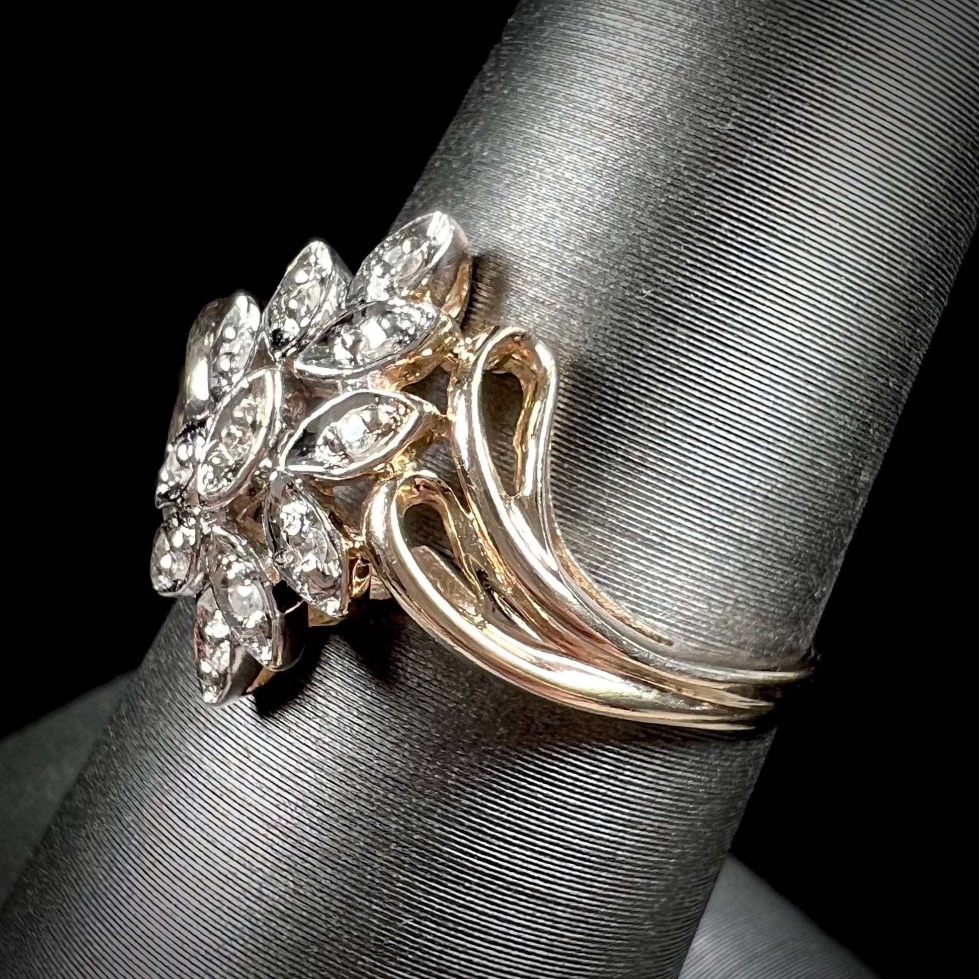 A ladies' vintage style gold diamond cluster ring.