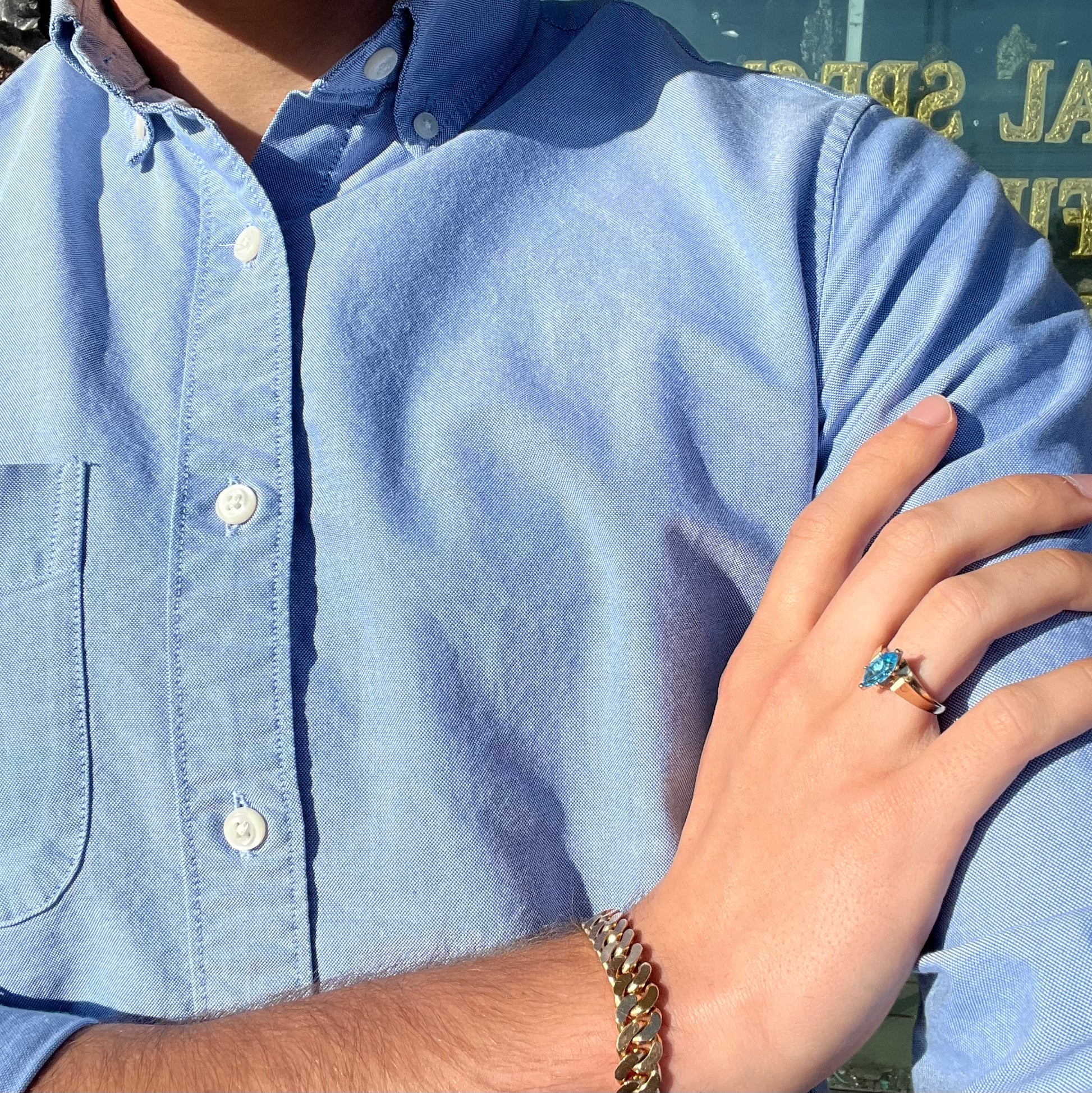 A ladies' estate yellow gold ring, prong set with a marquise cut blue topaz stone.  There are scratches on the shank.