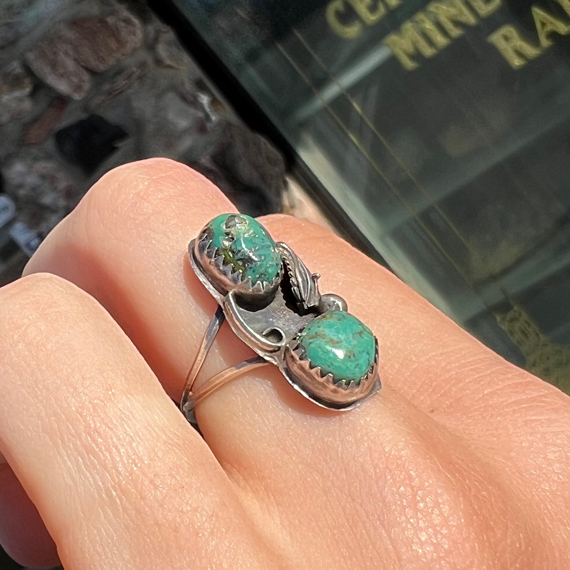 A ladies' sterling silver and green Morenci turquoise ring.  The ring is handmade in the Navajo style.