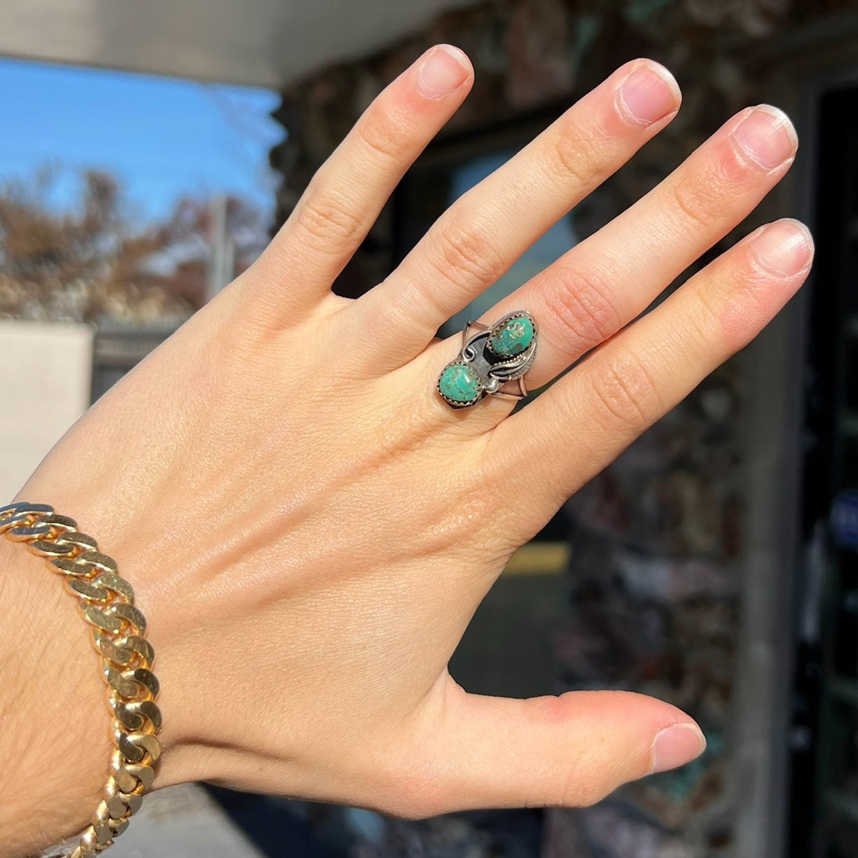 A ladies' sterling silver and green Morenci turquoise ring.  The ring is handmade in the Navajo style.