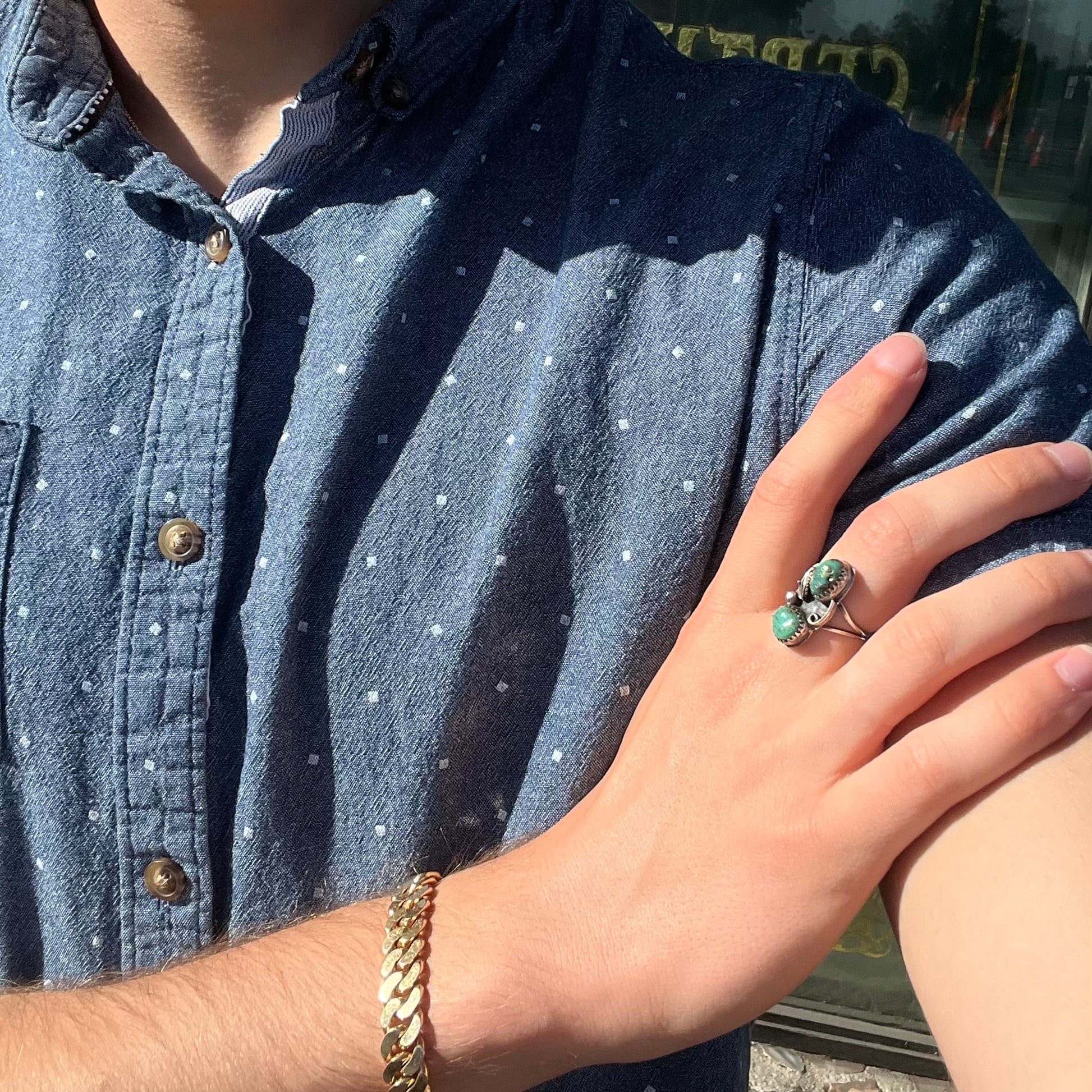 A ladies' sterling silver and green Morenci turquoise ring.  The ring is handmade in the Navajo style.