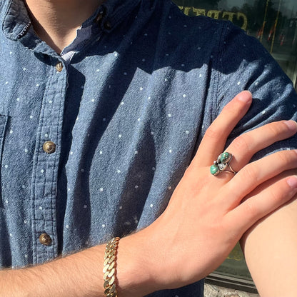 A ladies' sterling silver and green Morenci turquoise ring.  The ring is handmade in the Navajo style.