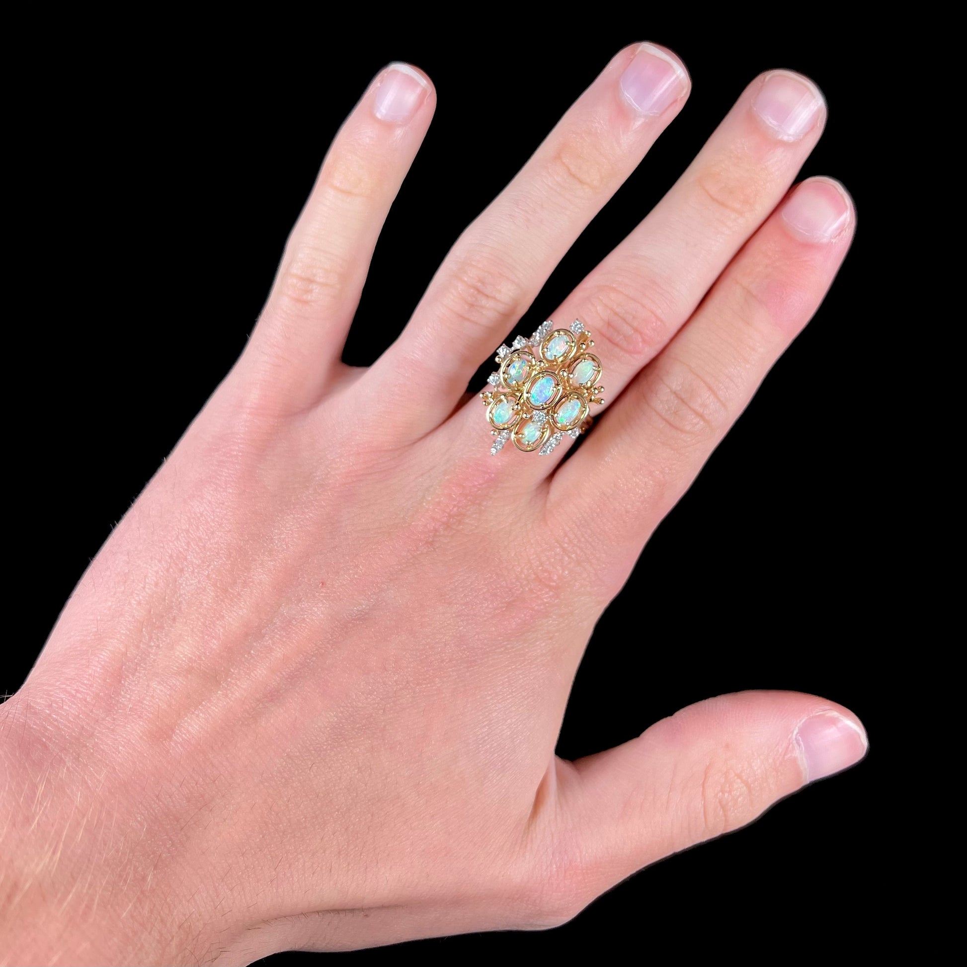 A ladies' vintage mid-century modern style opal and diamond cluster ring in yellow gold.