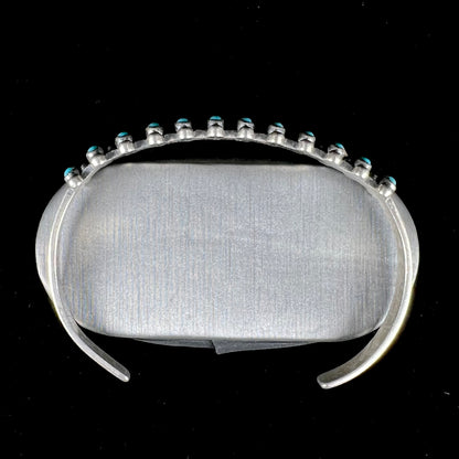 A ladies' sterling silver Zuni Indian turquoise cuff bracelet.  The stones are oval cut Sleeping Beauty turquoise.