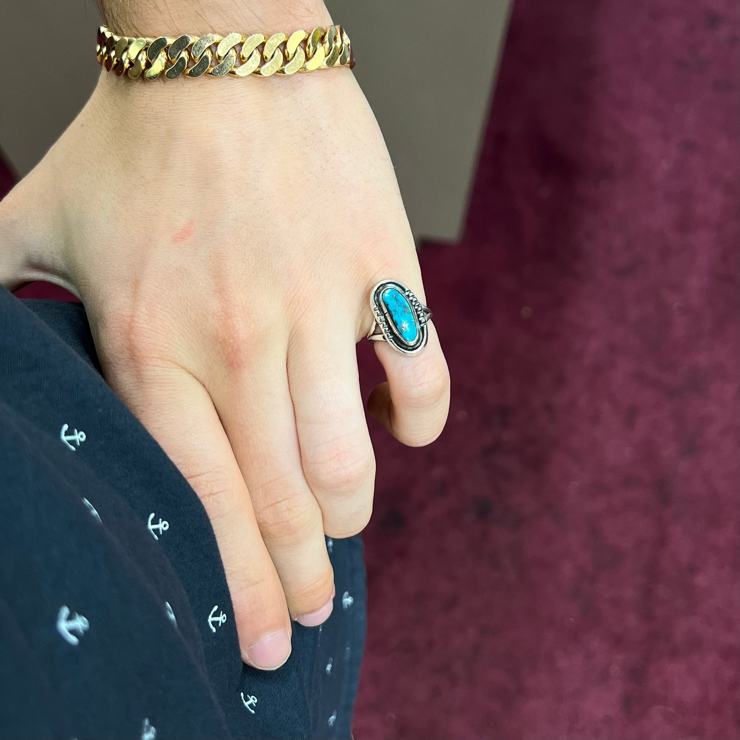 A handmade sterling silver Navajo style ring set with a Morenci turquoise stone.