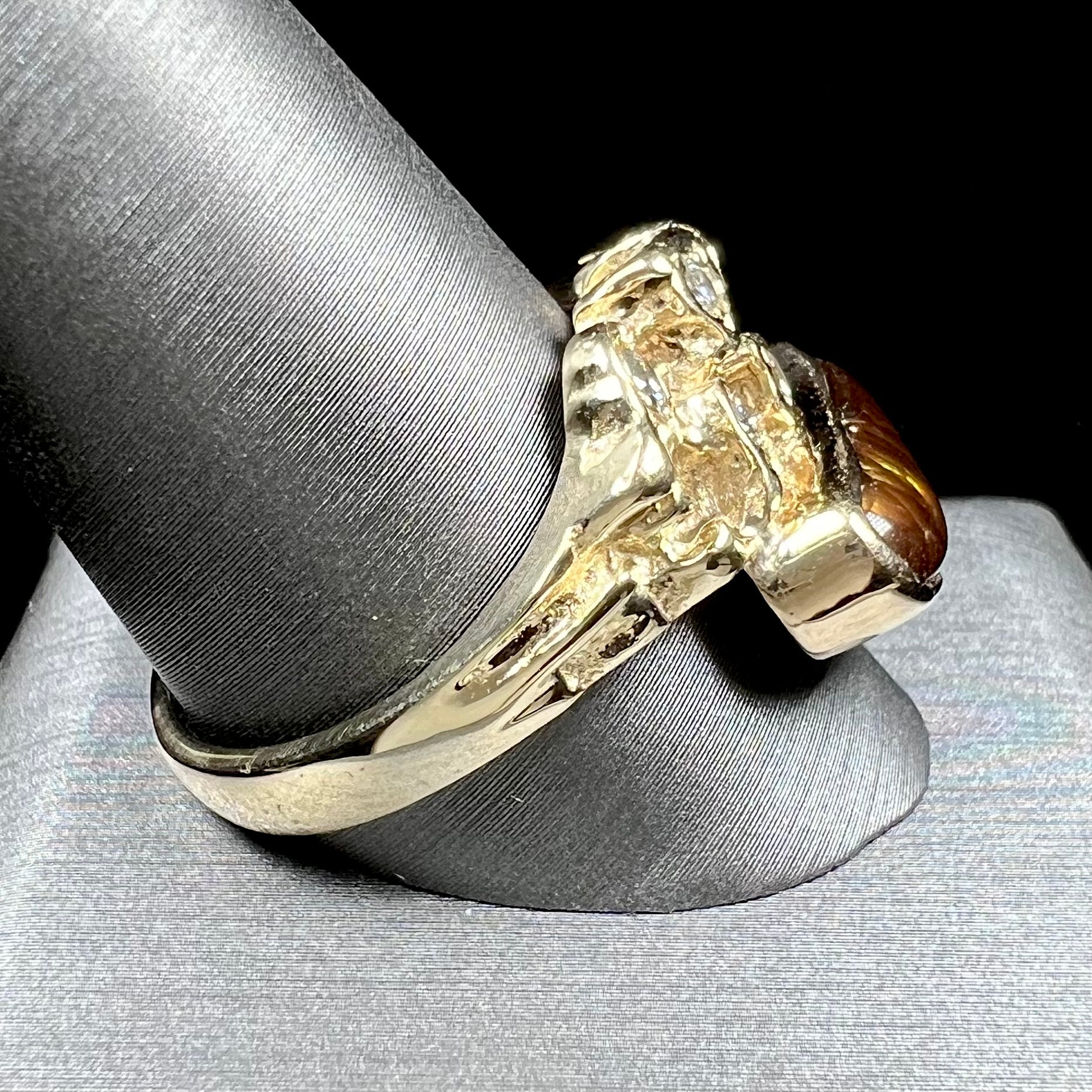 A ladies' nugget style yellow gold Mexican fire agate and diamond ring.