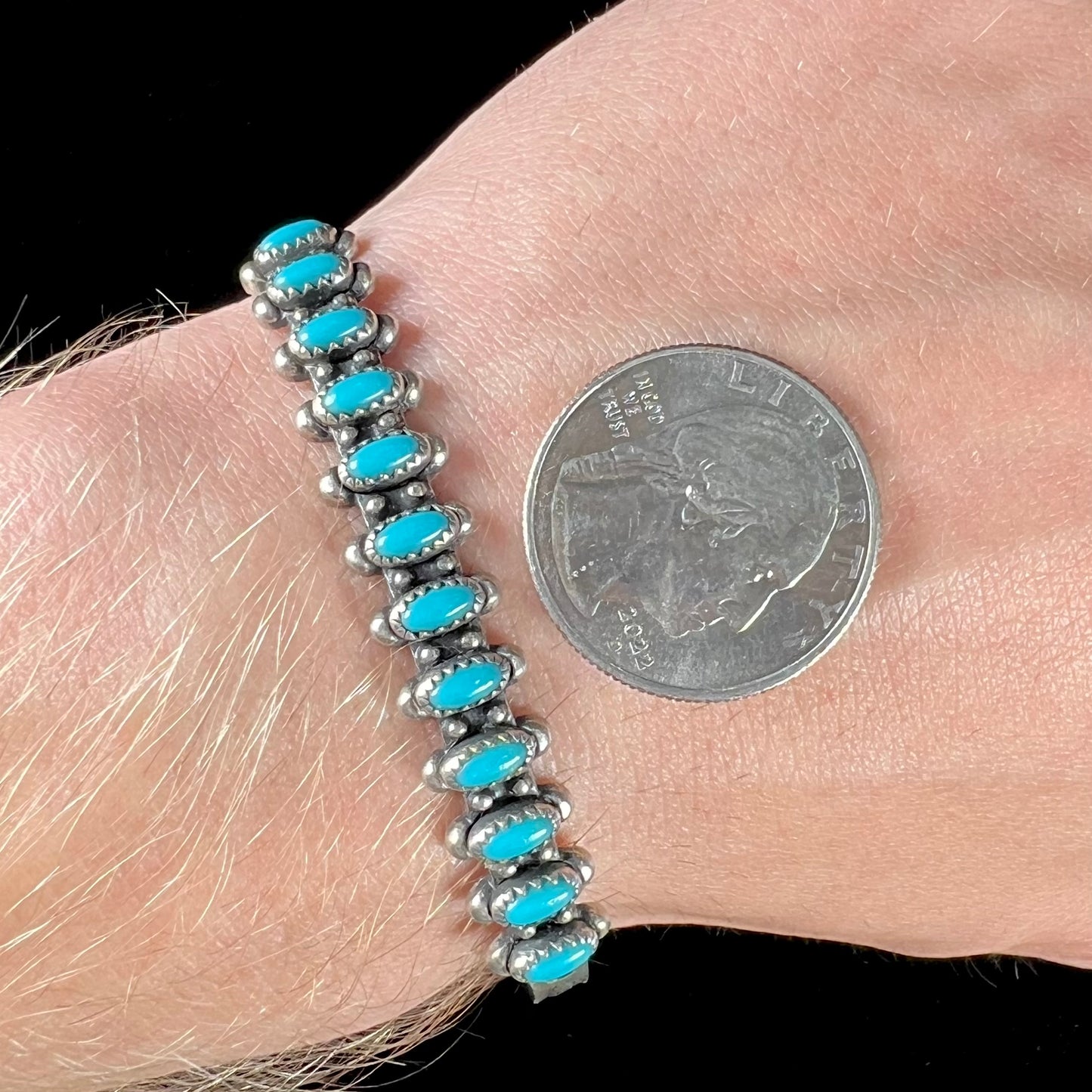 A ladies' sterling silver Zuni Indian turquoise cuff bracelet.  The stones are oval cut Sleeping Beauty turquoise.