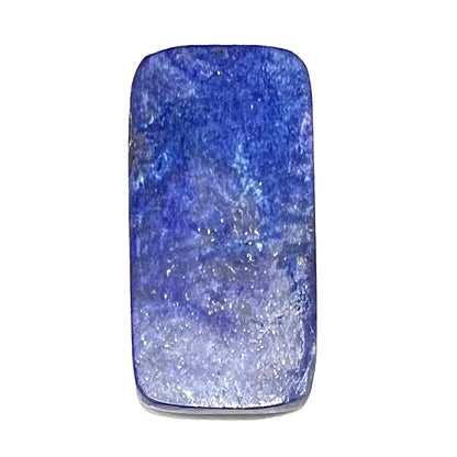 A loose, rectangle cabochon cut AA grade blue lapis lazuli stone.